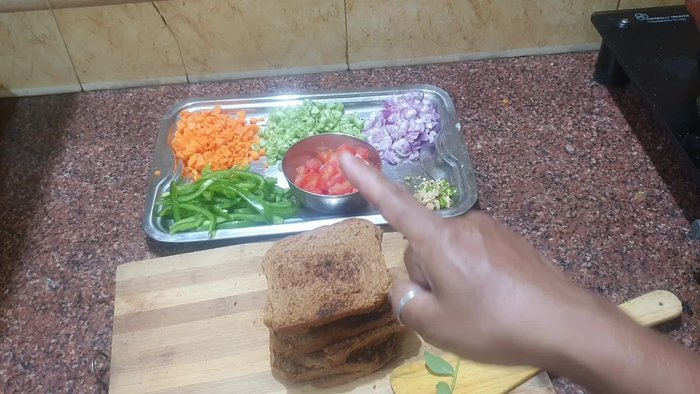 Dry roast 8 slices of bread. Chop carrots, beans, small onions, tomato, green chili, and ginger into small pieces.