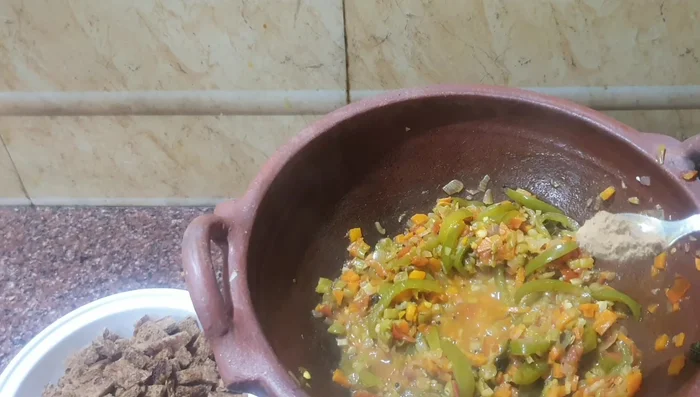 Check seasoning, adding chaat masala for extra flavor.