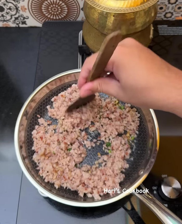 Add cooked Rajamudi rice, salt, and fry on high heat until aromatic.