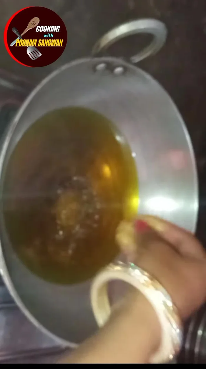 Heat oil in a pan on the gas stove.