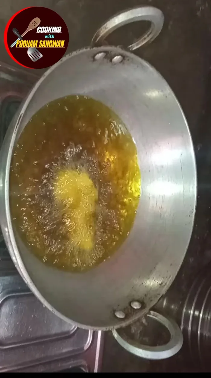 Fry the gulgula, turning them over, until they are golden brown.