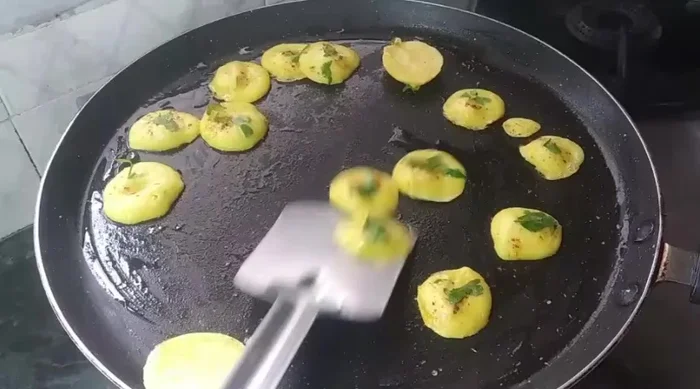 Flip the pancakes once they are cooked on one side. Cook until golden brown on both sides.