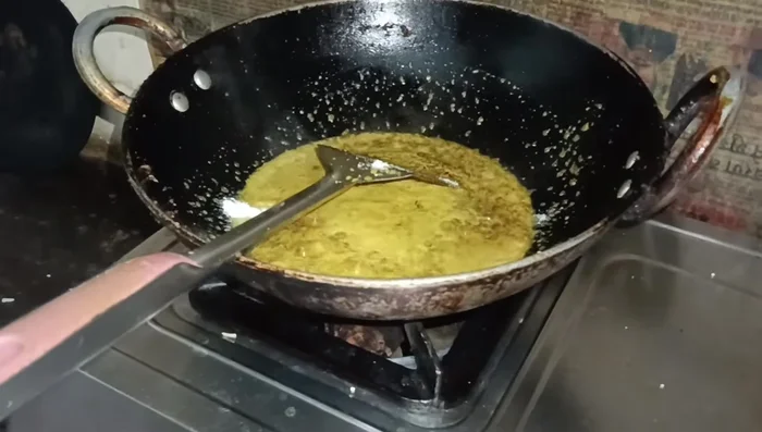 Add salt and tomatoes. Cook until the tomatoes soften and the mixture becomes a thick gravy. Adjust water as needed to achieve your desired gravy consistency.