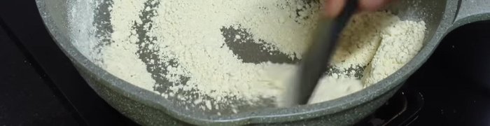 In the same bowl, dry roast 1 cup of peanut powder for 2-3 minutes until fragrant.