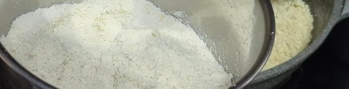 Add the ground nuts to the coconut and peanut powder mixture.