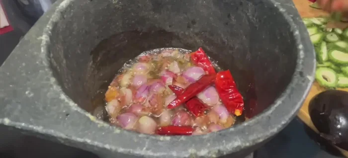 Add shallots and pavakai. Saute until softened.