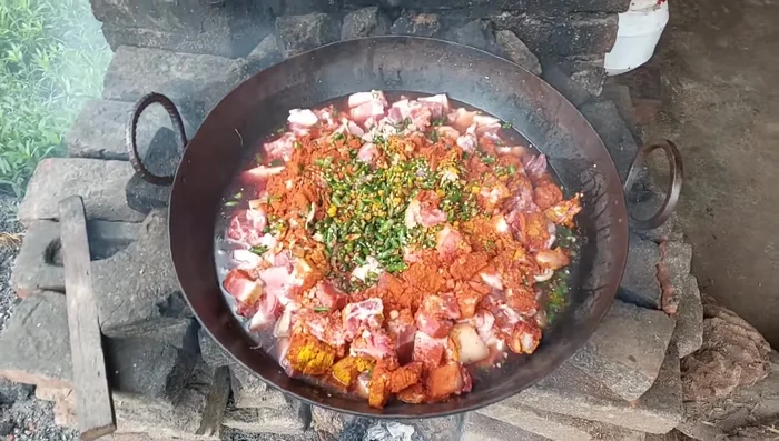 Cook the marinated pork in a large pan or tawa over medium heat, stirring occasionally. Add water if needed.