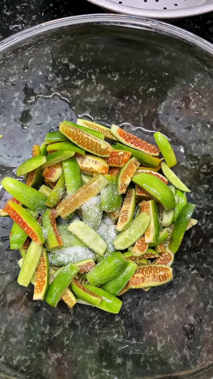 Add salt, besan (gram flour), rice flour, chili powder, and ginger-garlic paste.