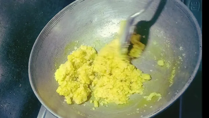 Add sugar and stir well until it dissolves and the halwa thickens.
