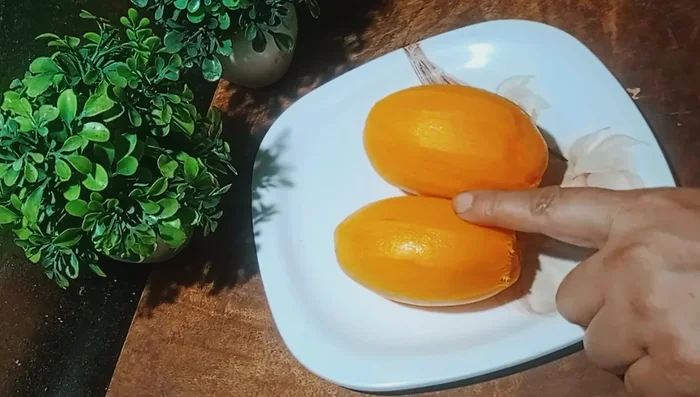 Peel and chop the mangoes roughly. Remove the seeds. Then make mango pulp using a mixer.