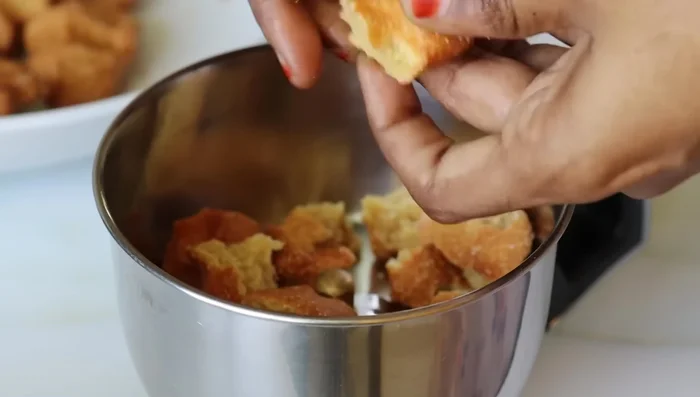 Once cooled, cut the fried pieces into small pieces and grind them into a fine powder using a blender.
